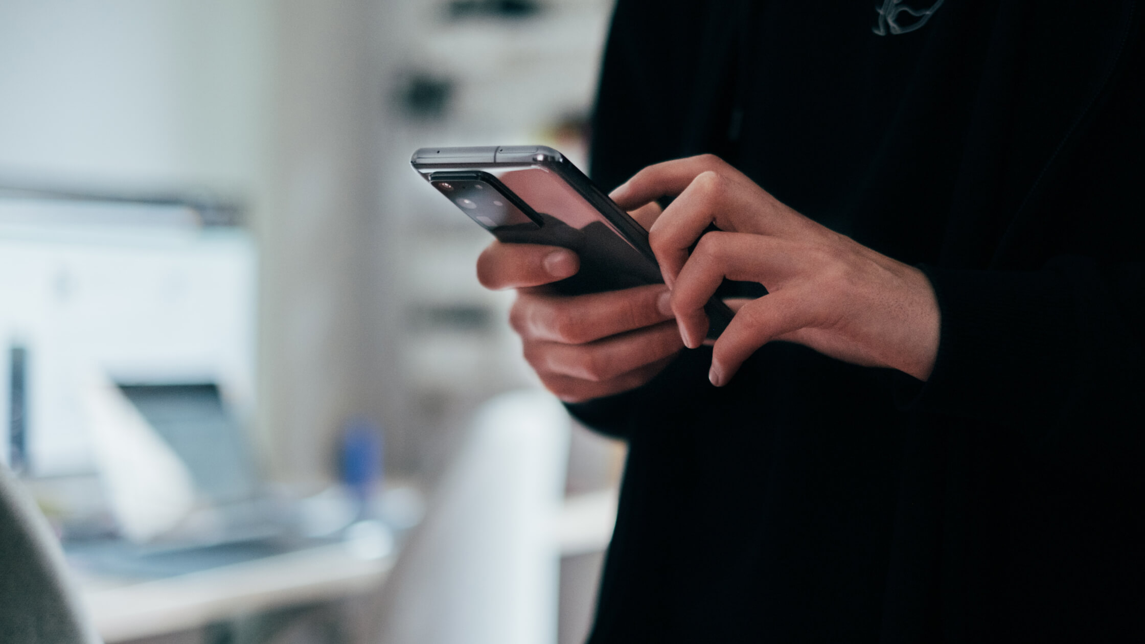 Operations coordinator using a mobile device on site