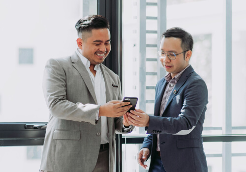 Two executives coordinating plans on site
